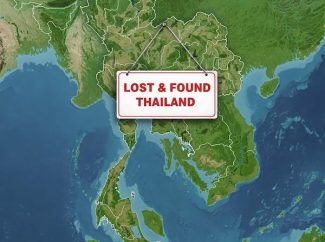 Lost and Found Thailand sign hung from the Country of Thailand on a satellite map.